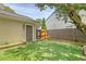 Well-maintained backyard with artificial turf, privacy fence, and a storage shed provides a relaxing outdoor space at 1743 Orange Grove Shores Dr, Charleston, SC 29407