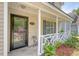 Close-up of the inviting front porch showcasing the home's entrance and charming details at 1743 Orange Grove Shores Dr, Charleston, SC 29407