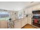 Kitchen area with stainless steel appliances, white cabinetry and breakfast bar seating at 1743 Orange Grove Shores Dr, Charleston, SC 29407