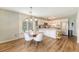 Sunlit kitchen and dining area, boasting a window seat and modern appliances, perfect for Gathering living at 1743 Orange Grove Shores Dr, Charleston, SC 29407