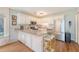 Bright kitchen featuring white cabinets, stainless steel appliances, and a charming breakfast nook at 1743 Orange Grove Shores Dr, Charleston, SC 29407
