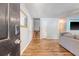 Open living room featuring wood floors, neutral paint and access to the stairway at 1743 Orange Grove Shores Dr, Charleston, SC 29407