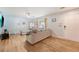 Spacious living room showcasing wood floors, sectional sofa, natural light, and a ceiling fan at 1743 Orange Grove Shores Dr, Charleston, SC 29407