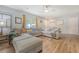 A well-decorated living room featuring a sectional couch, wood floors, and natural lighting at 1743 Orange Grove Shores Dr, Charleston, SC 29407