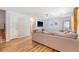 Bright living room boasts a large sectional sofa, ceiling fan, and wood flooring at 1743 Orange Grove Shores Dr, Charleston, SC 29407