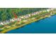 Waterfront townhomes with private patios and lush landscaping along the banks of the lake at 1751 Brittlebush Ln, Johns Island, SC 29455