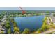 An aerial view highlights the townhomes beside a large pond, showing the community's layout at 1751 Brittlebush Ln, Johns Island, SC 29455