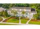 An aerial view showcases these symmetrically designed townhomes with manicured lawns and sidewalks at 1751 Brittlebush Ln, Johns Island, SC 29455