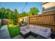 Backyard featuring a patio, artificial turf, and a wooden fence at 1751 Brittlebush Ln, Johns Island, SC 29455