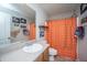 Bathroom showcasing a vanity with sink, toilet, and tiled shower with curtain at 1751 Brittlebush Ln, Johns Island, SC 29455