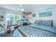 Bedroom features a large window, ceiling fan, and decorative shelves at 1751 Brittlebush Ln, Johns Island, SC 29455