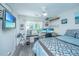 Bright bedroom with mounted TV, ceiling fan, and desk at 1751 Brittlebush Ln, Johns Island, SC 29455