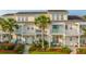 Inviting townhouse featuring classic architecture, white trim, and charming front porches at 1751 Brittlebush Ln, Johns Island, SC 29455