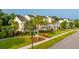 Beautifully landscaped townhomes with symmetrical design, lush greenery, and inviting front porches at 1751 Brittlebush Ln, Johns Island, SC 29455