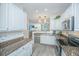 Bright kitchen with white cabinets, stainless appliances and granite countertops looking into the living area at 1751 Brittlebush Ln, Johns Island, SC 29455