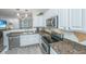 Functional kitchen with granite countertops, stainless steel appliances, and white cabinets at 1751 Brittlebush Ln, Johns Island, SC 29455