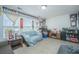 Living room with a large window, comfortable seating, and sports decor at 1751 Brittlebush Ln, Johns Island, SC 29455