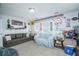 Spacious living room features comfortable seating and a large window at 1751 Brittlebush Ln, Johns Island, SC 29455