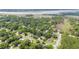 This aerial view displays a charming neighborhood with mature trees and homes near a waterway at 1833 St Julian Dr, Charleston, SC 29407
