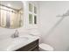 Bathroom featuring a decorative vanity, shower, mirror and lighting at 1833 St Julian Dr, Charleston, SC 29407