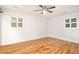 Bedroom with hardwood floors and shuttered windows at 1833 St Julian Dr, Charleston, SC 29407