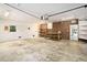 Spacious garage with ample storage and a work bench, perfect for DIY projects and organization at 1833 St Julian Dr, Charleston, SC 29407