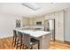 Well-lit kitchen with island, stainless steel appliances, and counter seating at 1833 St Julian Dr, Charleston, SC 29407