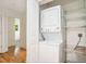 Convenient laundry area featuring a stackable washer and dryer, along with storage shelves at 1833 St Julian Dr, Charleston, SC 29407