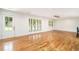 Bright living room with wood floors, recessed lighting, and natural light from large windows at 1833 St Julian Dr, Charleston, SC 29407