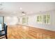 Bright, open living room with hardwood floors and plantation shutters on windows at 1833 St Julian Dr, Charleston, SC 29407