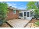 Wooden deck patio area adjacent to the brick home and sunroom at 1833 St Julian Dr, Charleston, SC 29407