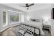 Bright bedroom featuring a large window and beachy decor at 1948 Marsh Oak Ln, Seabrook Island, SC 29455