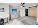 This bedroom features a barn door for the bathroom and a tv at 1948 Marsh Oak Ln, Seabrook Island, SC 29455