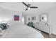 Serene bedroom with white furniture and a ceiling fan at 1948 Marsh Oak Ln, Seabrook Island, SC 29455