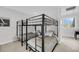 Bedroom with two sets of bunk beds and neutral tones, perfect for a ' room or guest space at 1948 Marsh Oak Ln, Seabrook Island, SC 29455