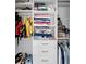 Walk-in closet features shelves, hanging storage and drawers at 1948 Marsh Oak Ln, Seabrook Island, SC 29455