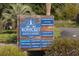 Entrance sign for Bohicket Marina & Market, listing restaurants and shops at 1948 Marsh Oak Ln, Seabrook Island, SC 29455