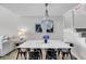 Modern dining area with elegant chandelier lighting and stylish decor at 1948 Marsh Oak Ln, Seabrook Island, SC 29455