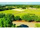 Aerial view of an equestrian estate with stables, paddocks, and a riding arena at 1948 Marsh Oak Ln, Seabrook Island, SC 29455