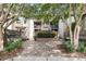 Exterior shot of a condo building with a brick walkway and lots of landscape at 1948 Marsh Oak Ln, Seabrook Island, SC 29455