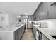 Beautiful kitchen with gray cabinets, white countertops, stainless steel appliances, and a herringbone wood floor at 1948 Marsh Oak Ln, Seabrook Island, SC 29455