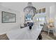 Open-concept living area with a chandelier, fireplace, and serene water views at 1948 Marsh Oak Ln, Seabrook Island, SC 29455