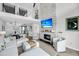 Open-concept living area with large windows, fireplace, and comfortable seating at 1948 Marsh Oak Ln, Seabrook Island, SC 29455