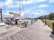 Scenic marina view showcasing boats docked along a wooden pier at 1948 Marsh Oak Ln, Seabrook Island, SC 29455