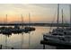 Picturesque view of sailboats and yachts docked at the marina during a serene sunset at 1948 Marsh Oak Ln, Seabrook Island, SC 29455