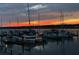Nighttime view of the marina, with boats docked and bright skies reflected in the water at 1948 Marsh Oak Ln, Seabrook Island, SC 29455