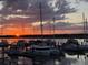 Sunset view of the marina, with colorful skies and boats reflected in the water at 1948 Marsh Oak Ln, Seabrook Island, SC 29455