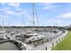 Daytime marina view with several boats docked along the wooden pier in the foreground at 1948 Marsh Oak Ln, Seabrook Island, SC 29455