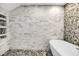 Luxurious shower featuring stone floors and walls with storage at 1948 Marsh Oak Ln, Seabrook Island, SC 29455