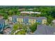 Bright apartment complex featuring blue and yellow exterior with tree lined parking and manicured landscaping at 2000 Belle Isle Ave # 204, Mount Pleasant, SC 29464